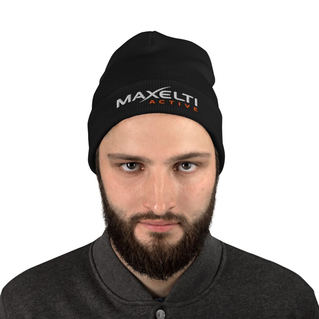 Man wearing the black embroidered knit beanie with the cuff folded over his ears