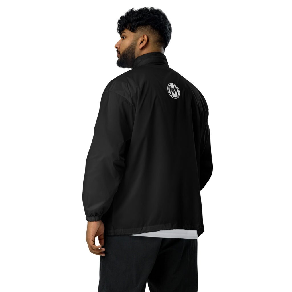Man wearing the black hooded windbreaker jacket, back view with the M emblem below the collar